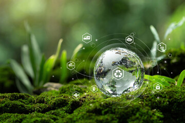 Green logistics management process related to the environmentally friendly transportation of goods.Sustainable transport and renewable energy.Crystal globe glass with green transportation icons.