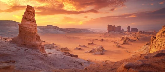 Fototapete Stunning desert landscape in a national park showcasing unique rock formations under a vibrant orange and red sky ideal for hiking and exploration © NFTNexus