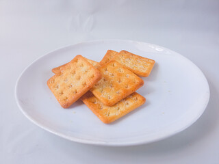 Sugar coated biscuits, also known as malkist, sweet and crispy. Served on white plate