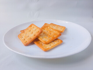 Sugar coated biscuits, also known as malkist, sweet and crispy. Served on white plate