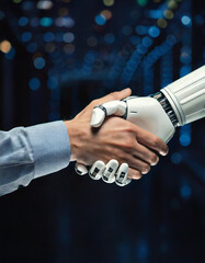 White robotic hand shaking a businessman's hand on a blurred blue background, symbolizing collaboration.