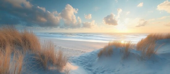 tranquil beach landscape at sunset with gentle waves and wispy clouds over soft dunes and golden grasses in serene coastal setting