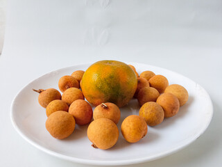 longan fruit on a plate isolate on white background