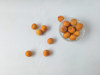 longan fruit on a plate isolate on white background