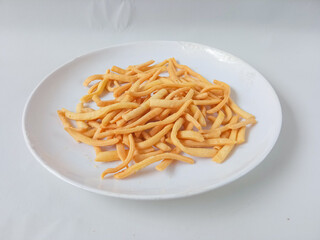 onion stick snack, delicious snack on plate isolate on white background.