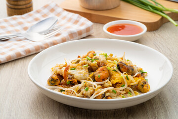 Oyster omelette,Pan fried crispy New Zealand Mussels with bean sprout,Thai crispy pancake in white plate