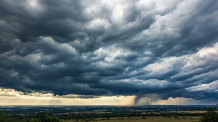 Obraz premium Dramatic storm clouds over a flat landscape.