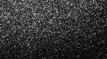 Obraz premium A shimmering black glitter texture creating a sparkling abstract background, ideal for festive, elegant, or decorative projects.