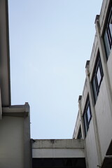Dark gray building with blue sky without clouds