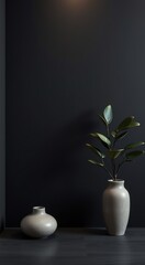 Two grey vases with a plant on a dark background.