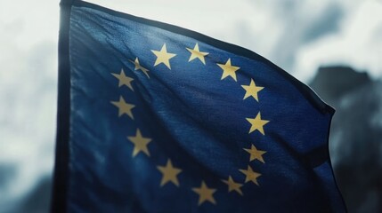 Close-up of a European Union flag billowing in the wind, showcasing its deep blue color and golden stars.  A symbol of unity and international cooperation.