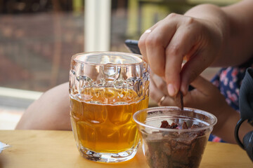 a glass of beer on the table and a snack of toast with garlic