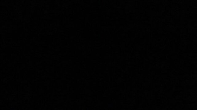 Pulsing white flashes illuminate the screen, creating a dynamic and energetic background against a sleek, dark setting.