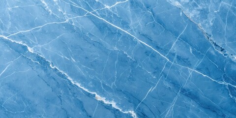 Obraz premium High-resolution image of a blue marble stone texture with white veining patterns