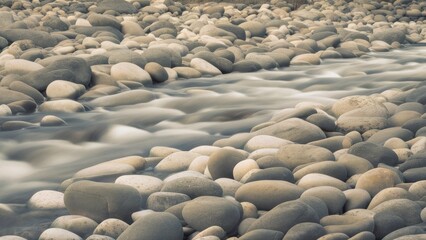 Smooth Pebbles Background with Polished River Stones in Muted Gray, Taupe, and Creamy White &ndash; High-Quality Texture

