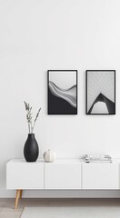Minimalist living room with black vase, framed art, and white console table.