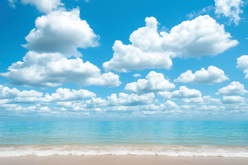 Fototapeta premium Blue Sky with White Clouds Above Tranquil Sea and Sandy Beach