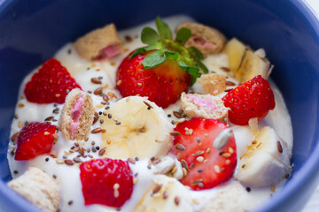 Natural yogurt with strawberries, banana, cereals and seeds. Healthy food. Healthy breakfast.