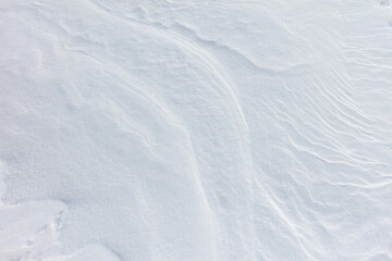 The snow is white and the ground is covered in it