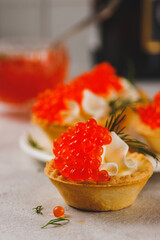 Tartlets with red caviar and cottage cheese