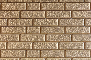 A brick wall with a rough texture