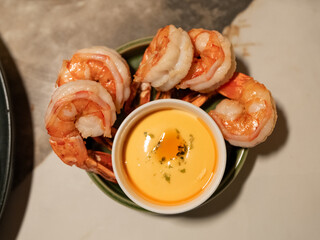 Grilled shrimps on plate on marble table