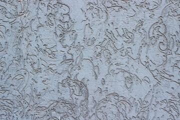 Close-up texture of blue cement plaster with a rough surface and unique patterns