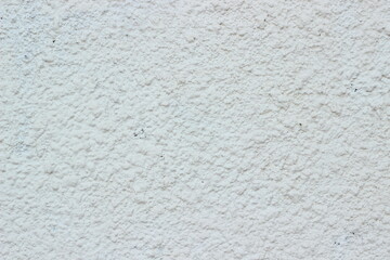 Close-up of white cement plaster texture with a rough surface. Perfect for creating backgrounds or textured elements in design projects