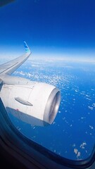 air airplane wings window sky blue clouds travel fly