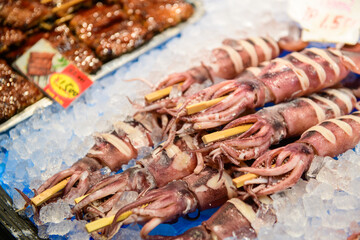 squid and seafood in kuromon market, Osaka Japan
