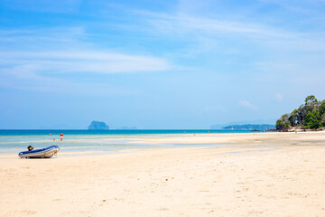 Seascape. Travel and tourism. Sea coast with islands of Krabi province in Thailand, motor boat on the shore