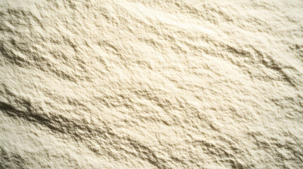 Close-up texture of fine, off-white powder; ideal for backgrounds, culinary, or cosmetic applications.