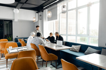 Collaborative Multiracial Team Meeting in Modern Office Lounge