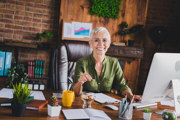 Photo of successful lady hr dressed shirt glasses eat snack workplace workstation loft interior indoors