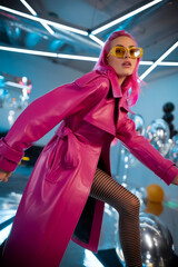 Beautiful model in leather pink coat. Fashion creative photo shoot. Fashionable avantgarde style photography for magazines.