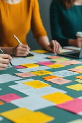 Group of people brainstorming around a table covered with sticky notes and sketches, collaboration, creative business solutions