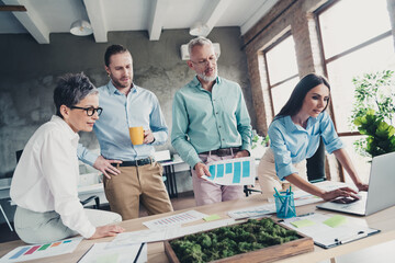 Photo of teamwork people working together confident brainstorming comfortable modern office loft room interior indoors workspace