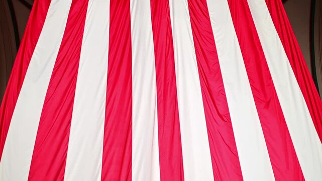 Huge American flag flying from a high ceiling in Boston, Massachusetts, USA at the North End of the city.