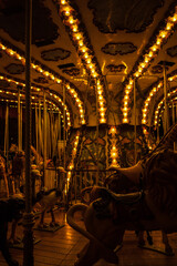 Old vintage carnival carousel in winter. Lyon, France.