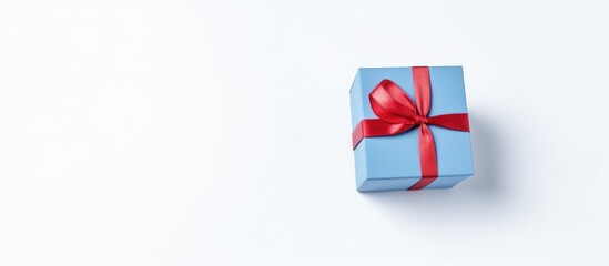 Gift box with red ribbon on classic blue background for Valentine s Day and Mother s Day celebrations minimalistic design with copy space
