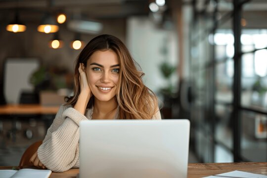Happy mature business woman using laptop in office smiling confident professional middle aged female working at desk video call with friends or family - Powered by Adobe