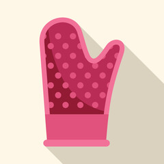 Pink oven mitt with white polka dots, offering protection from heat while handling hot cookware in the kitchen