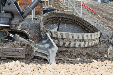 Excavator lost broken track and waiting for repair