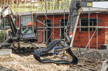 Excavator lost broken track and waiting for repair