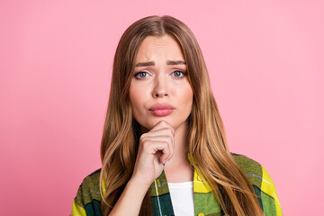 Photo portrait of pretty young girl look stressed upset minded wear yellow plaid clothes isolated on pink color background