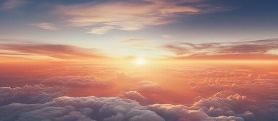 Fototapeta premium Majestic sunrise above clouds from an airplane window showcasing vibrant colors and serene skies at dawn