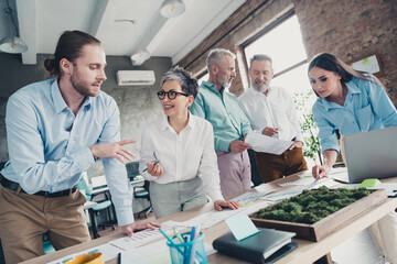 Photo of teamwork startup partners confident working project brainstorming comfortable nice creative startup office loft room interior