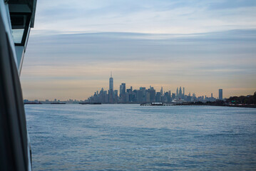 Ferry arriving with NYC Skyline