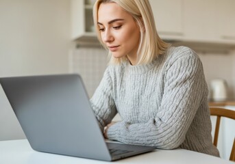Young Woman Working on Laptop in Cozy Kitchen