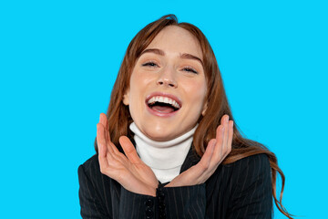 Woman smiling brightly against a colorful backdrop while showcasing joyful expression and style